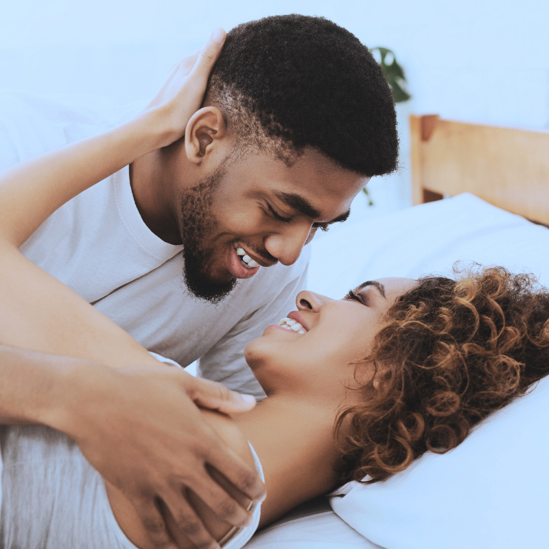 A diverse team of healthcare professionals in scrubs and white coats having a collaborative discussion